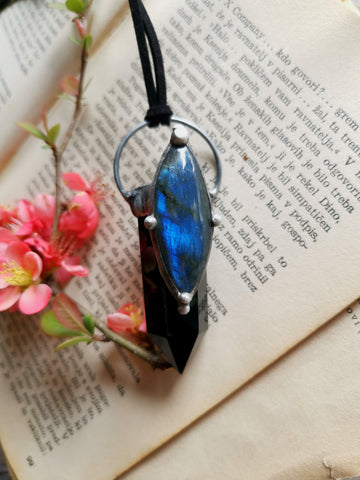 Black obsidian point with blue labradorite