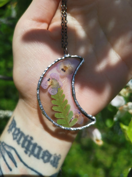 Glass moon pendant with flowers and fern
