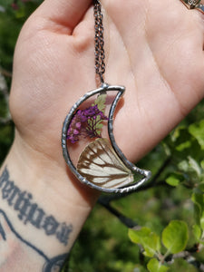 Glass moon with butterfly wing