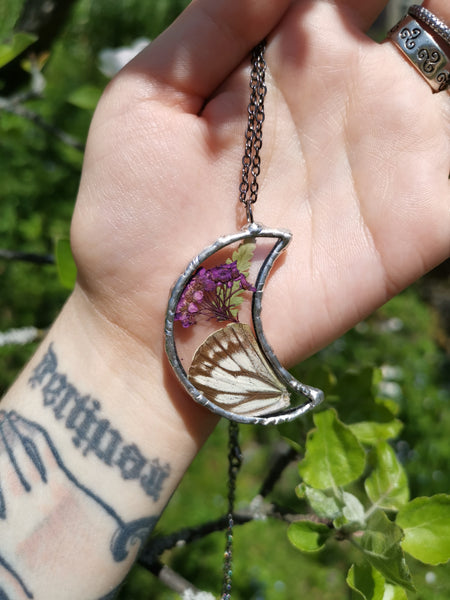 Glass moon with butterfly wing
