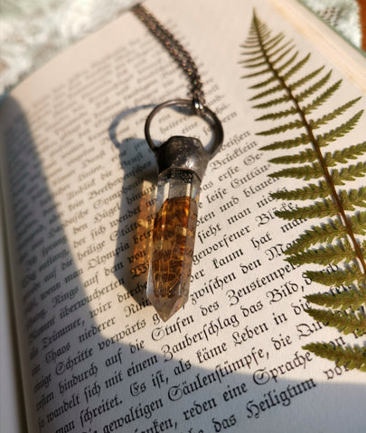 Resin crystal necklace with butterfly wing