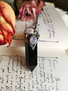 Black obsidian point pendant with moonstone crystal