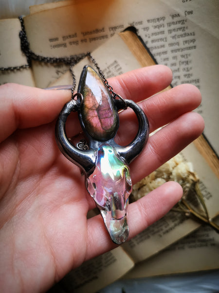 Iridescent glass ox skull pendant with pink/purple labradorite