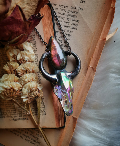 Iridescent glass ox skull pendant with pink/purple labradorite