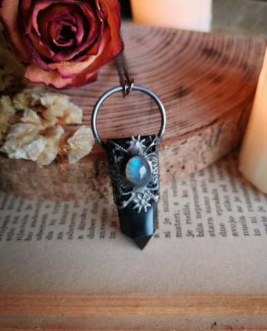 Ornate black obsidian point pendant with blue labradorite