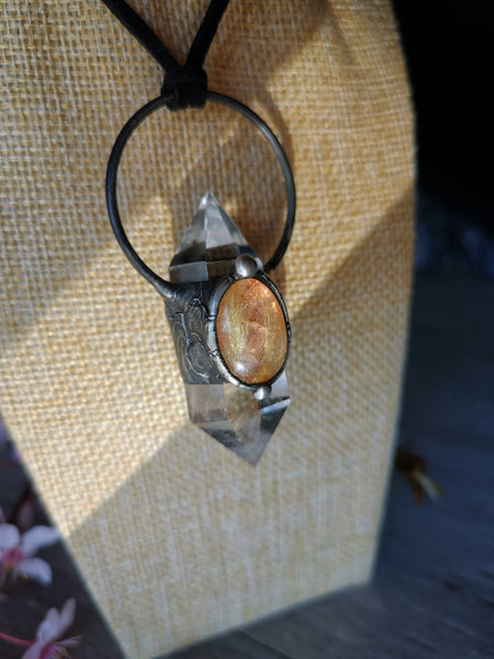 Clear quartz and golden rutilated quartz pendant