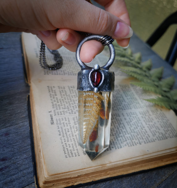 Botanical crystal pendant with garnet