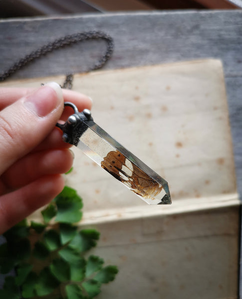 Resin crystal necklace with butterfly wing