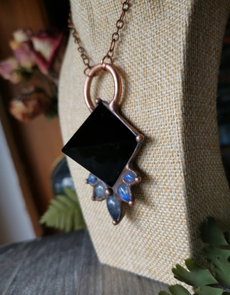 Necklace with black obsidian pyramid and rainbow moonstones