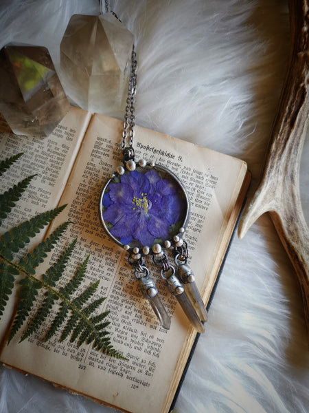 Glass pendant with dried flower and smoky quartz