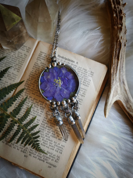 Glass pendant with dried flower and smoky quartz