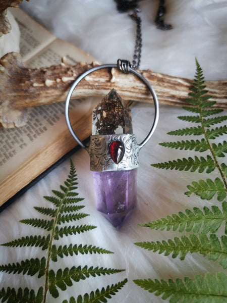 Resin crystal pendant with amethyst and red garnet