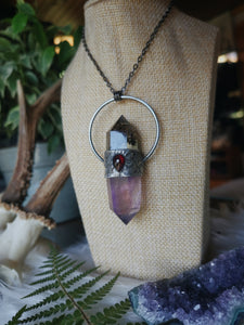 Resin crystal pendant with amethyst and red garnet