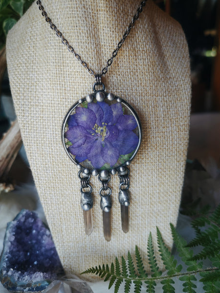 Glass pendant with dried flower and smoky quartz