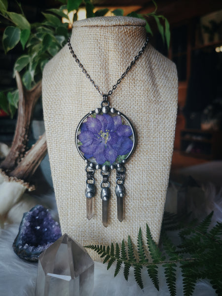 Glass pendant with dried flower and smoky quartz