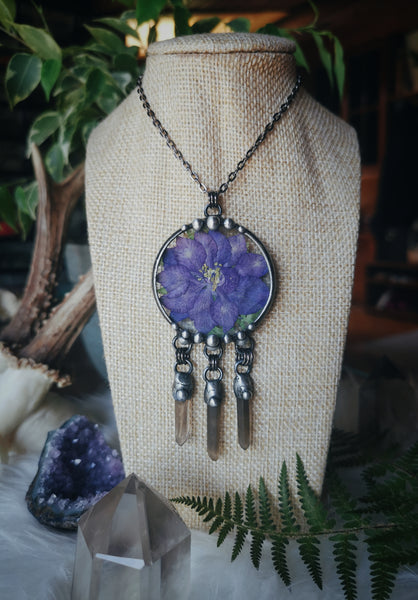 Glass pendant with dried flower and smoky quartz