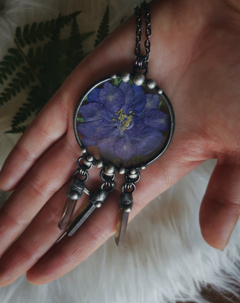 Glass pendant with dried flower and smoky quartz