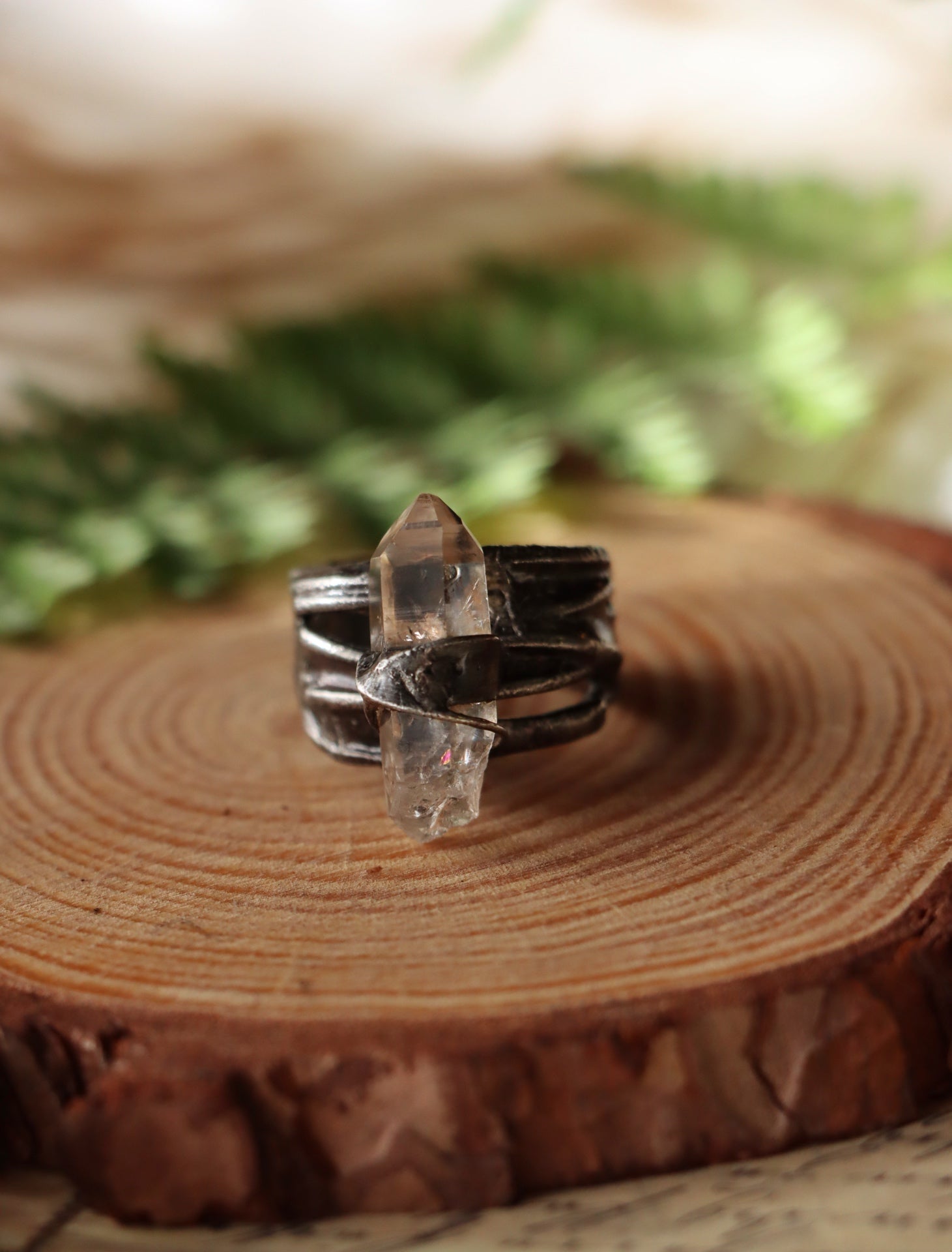 "Bound" ring with clear quartz