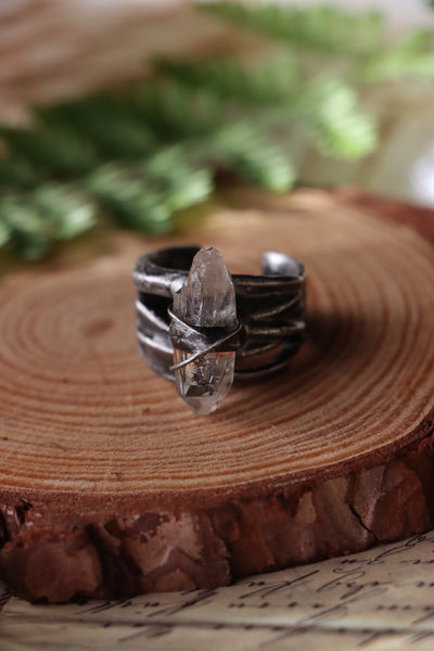 "Bound" ring with clear quartz