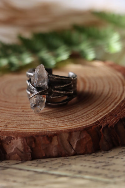 "Bound" ring with clear quartz